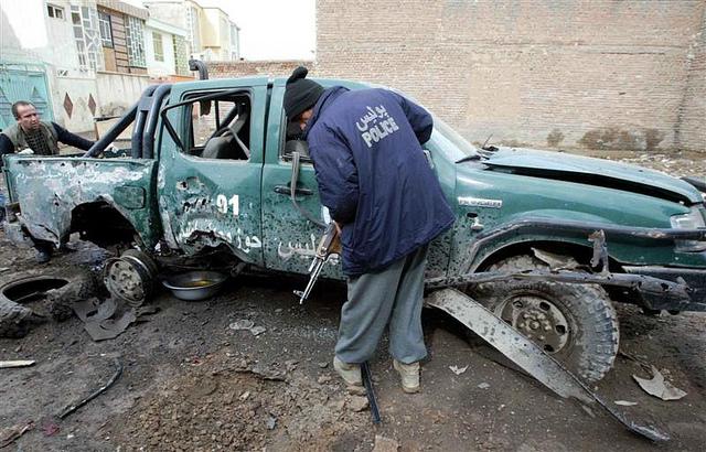 police vehicle damaged by a bomb explosion in western Herat province