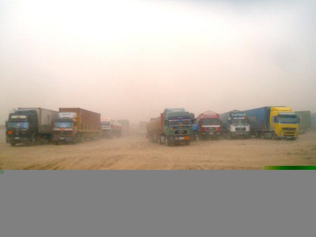Fed up with giving money at Sher Khan port: Truckers