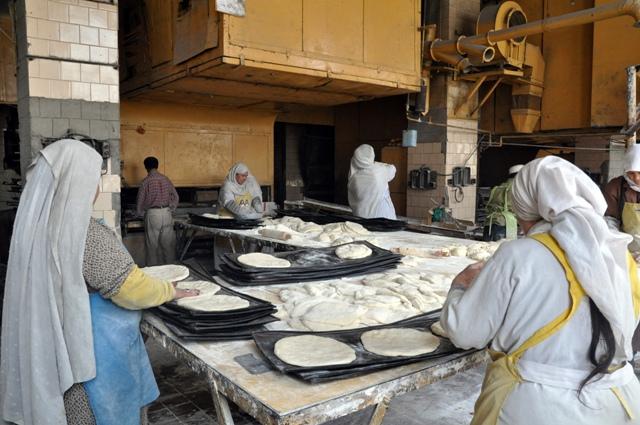 Women bake bread at the Kabul Silo/Bakery