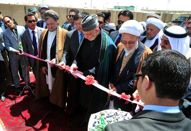 President Hamid Karzai and other officials cut the ribbon