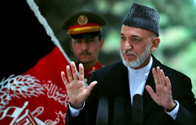 Karzai returns, invites Sharif to Kabul