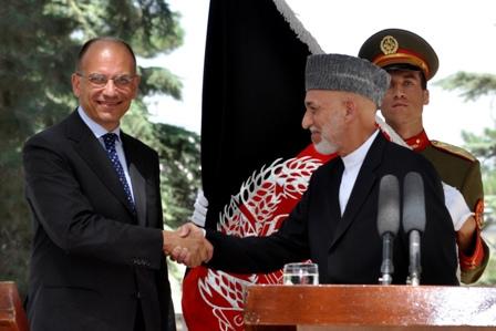 President Hamid Karzai shakes hands with Italian Prime Minister