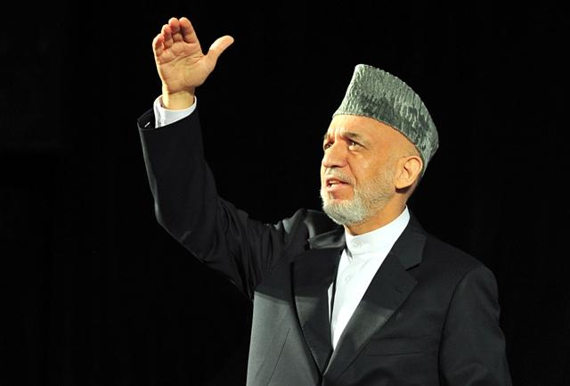 President Hamid Karzai takes a question