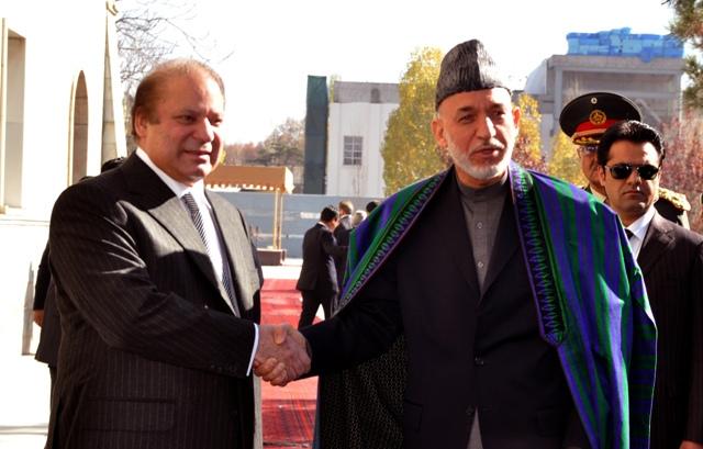 Hamid Karzai shakes hand with Pakistan Prime Minister