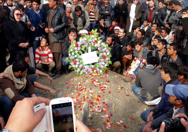 Calls for investigation as journalist laid to rest