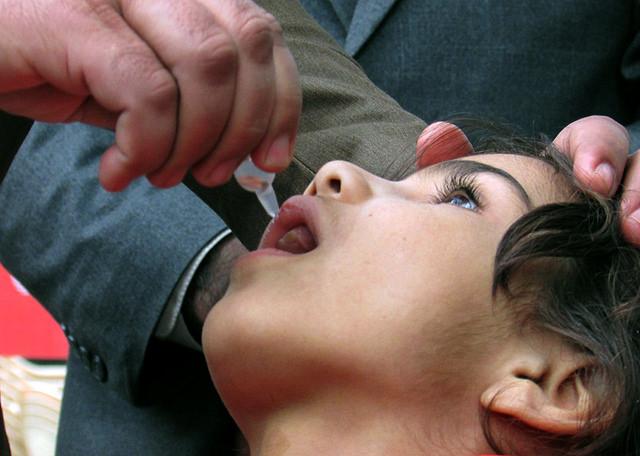 A child receives polio vaccination