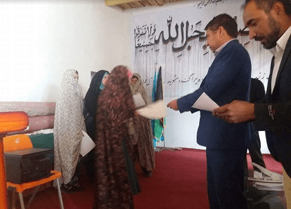 Illiterate Bamyan women being taught how to vote