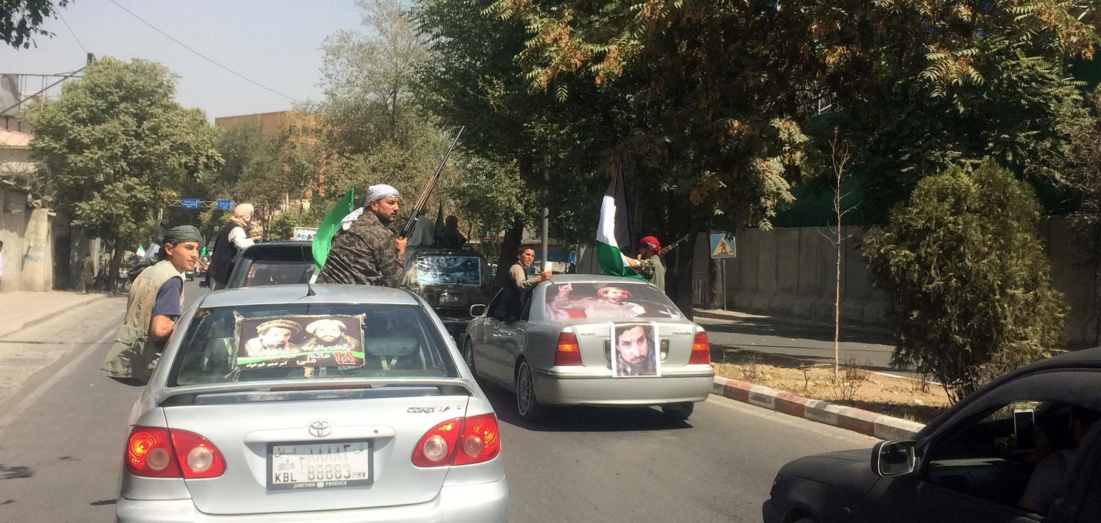 Massoud supporters carrying weapons