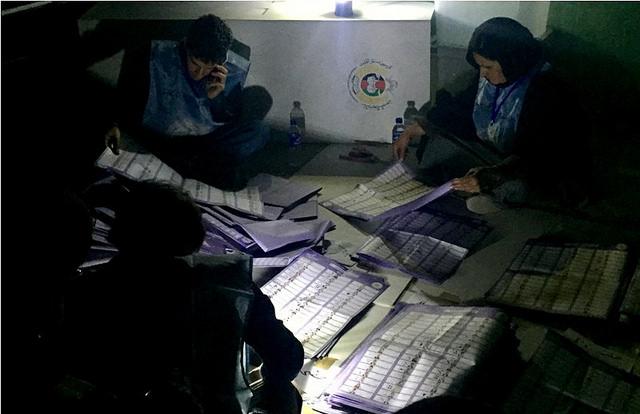 IEC workers count vote at a polling centre – Kabul