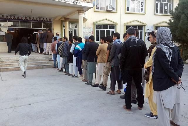 People wait in queue for vote