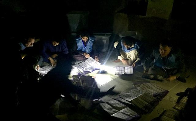 IEC workers count votes at a polling station- Kabul