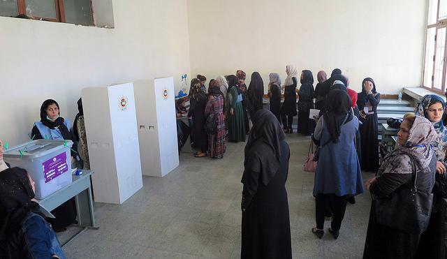 Women wait in queue for vote