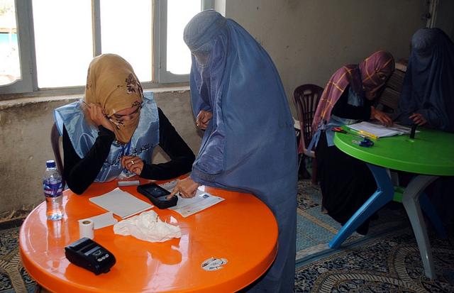 IEC worker use Biometric device in ballot