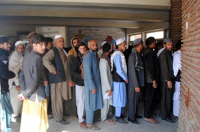 Voters wait in queue for ballot
