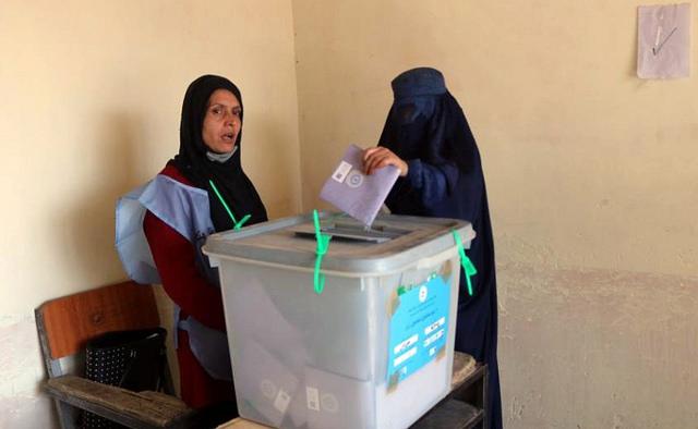 Woman in burqa cast vote
