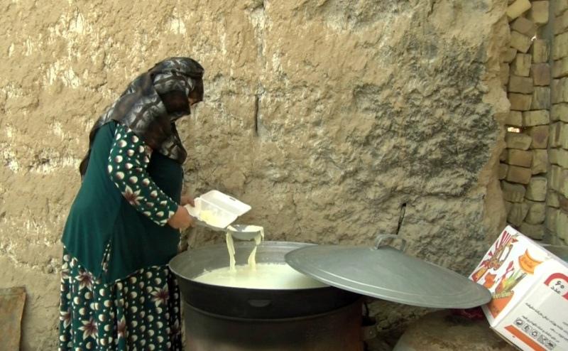 A woman boiling milk