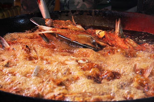 A view of fishes being cooked