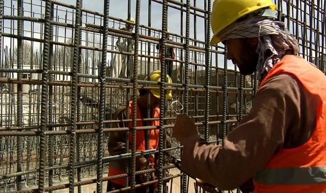 Workers building bridge in Baghlan