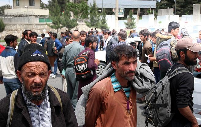 Afghans deported from Turkey block Kabul airport road