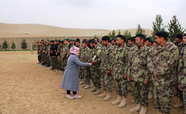 Civil activist presents flowers to ANA soldiers
