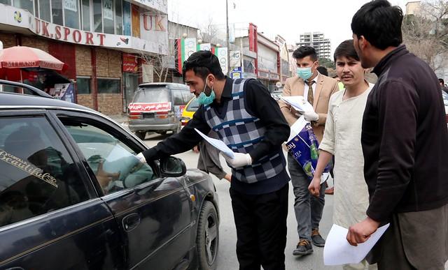 Civil society members distribute face masks in Kabul