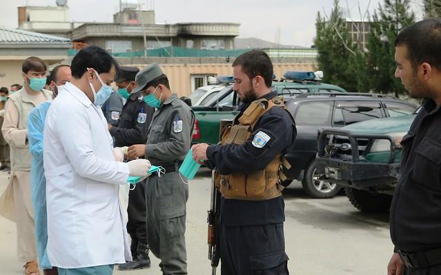 Civil activists distribute face masks to police personnel