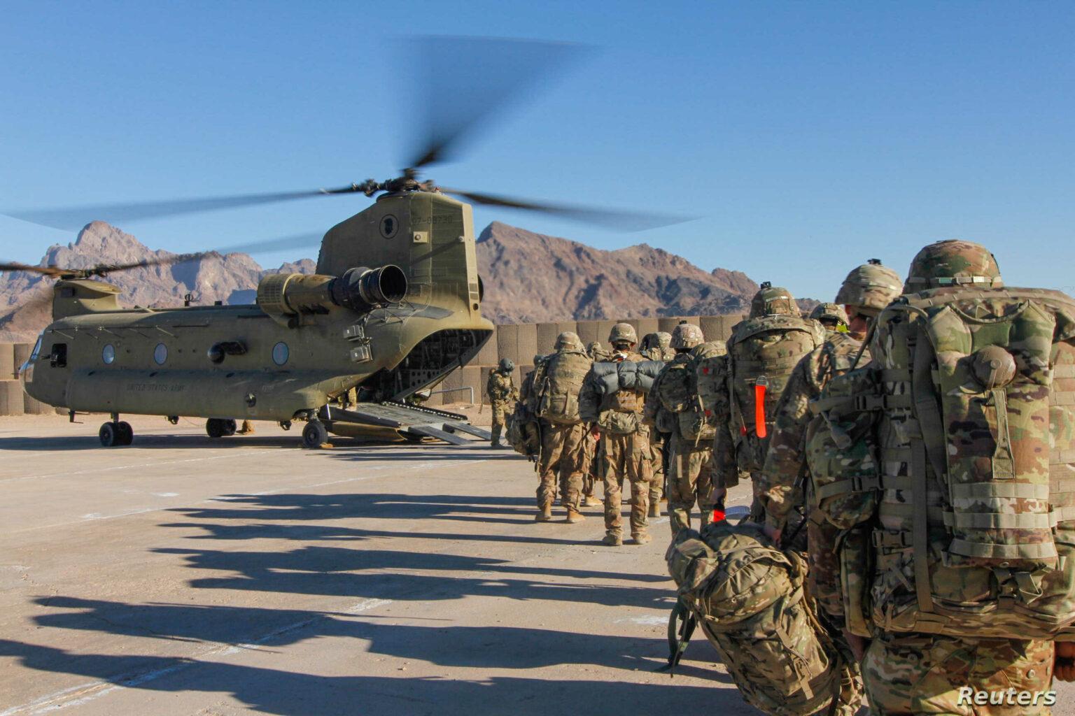 Soldiers attached to the 101st Resolute Support Sustainment Brigade, Iowa National Guard and 10th Mountain, 2-14 Infantry Battalion, load onto a Chinook helicopter to head out on a mission in Afghanistan, January 15, 2019. 1st Lt. Verniccia Ford/U.S. Army/Handout via REUTERS ATTENTION EDITORS - THIS IMAGE WAS PROVIDED BY A THIRD PARTY. - RC110D3B25B0