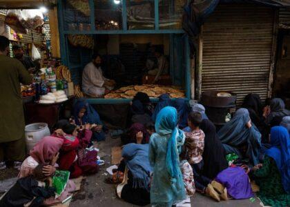 Poor Afghan women beg for bread at bakeries to survive