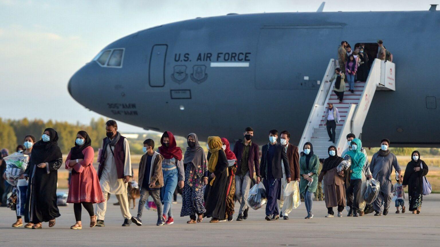 Refugees disembark from a US air force aircraft after an evacuation flight from Kabul at the Rota naval base in Rota, southern Spain, on August 31, 2021. - Spain has agreed to host up to 4,000 Afghans who will be airlifted by the United States to airbases in Rota and Moron de la Frontera in southern Spain. (Photo by CRISTINA QUICLER / AFP) (Photo by CRISTINA QUICLER/AFP via Getty Images)