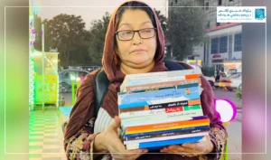 Aziza selling books to eke out living for her children in Kabul