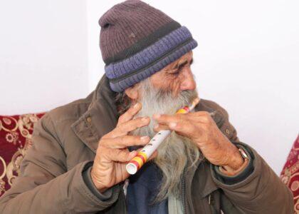 Devastated Janan Mama plays flute to distract his grief