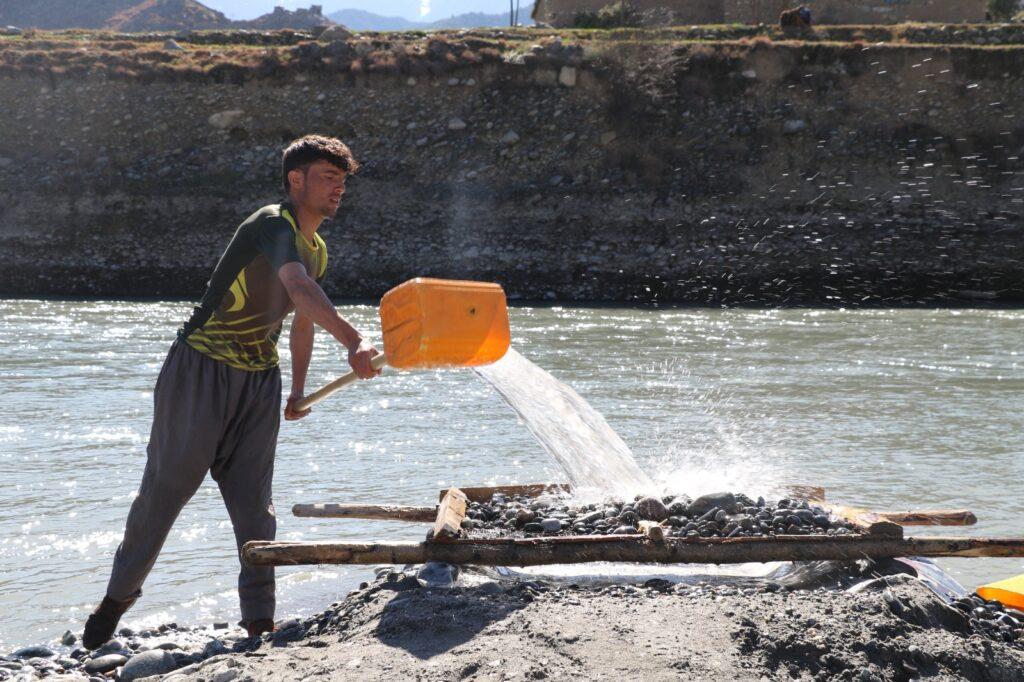 Shegal residents search for gold in Kunar River’s sand