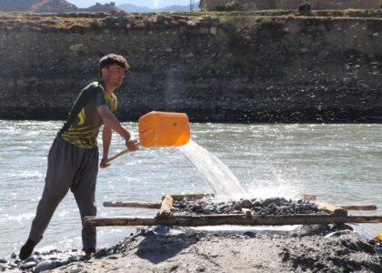 Shegal residents search for gold in Kunar River’s sand