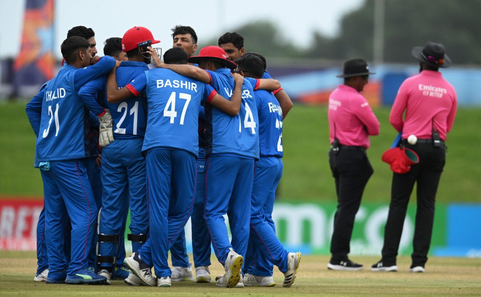 EAST LONDON, SOUTH AFRICA - JANUARY 23: Players of Afghanistan huddle during a review during the ICC U19 Men's Cricket World Cup South Africa 2024 match between New Zealand and Afghanistan at Buffalo Park on January 23, 2024 in East London, South Africa. (Photo by Johan Rynners-ICC/ICC via Getty Images)