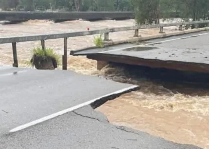 Australian floods wash away parts of key highway