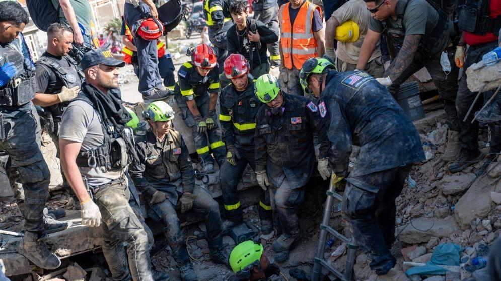 Man, teenage son rescued in Venezuela quake rubble as death toll rises